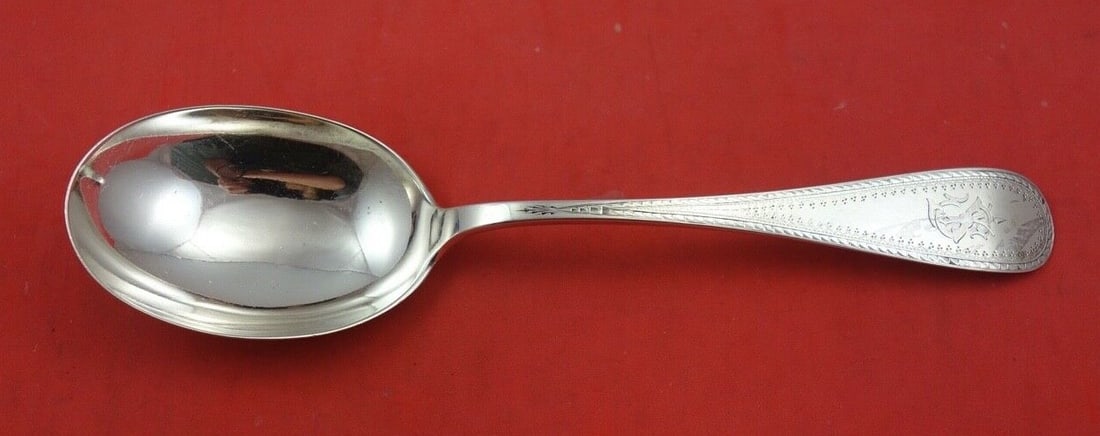 Bigelow & Kennard Reeded Edge Sterling Silver Serving Spoon 9": Bigelow & Kennard Reeded Edge Sterling Silver Serving Spoon 9" This exquisite serving spoon, measuring 9 inches, showcases the elegant Reeded Edge pattern by Bigelow & Kennard. Crafted from high-quali
