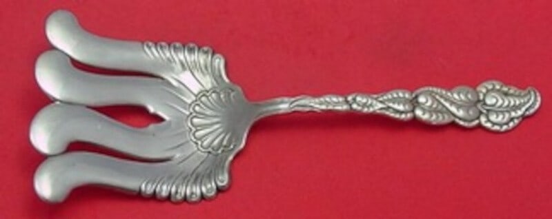 Tiffany & Co Ailanthus Sterling Silver Asparagus Fork 9.5" Loopy Tines: Tiffany & Co Ailanthus Sterling Silver Asparagus Fork 9.5" Loopy Tines This exquisite asparagus fork from Tiffany & Co. features the elegant Ailanthus pattern, showcasing distinctive loopy tines. Craf