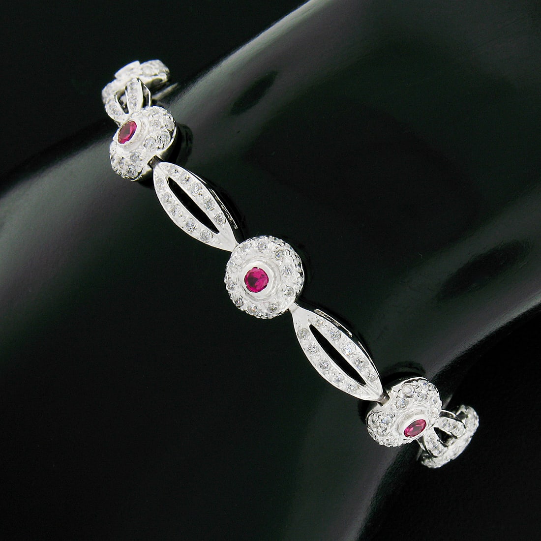 6.75 inch 18k White Gold Tennis Bracelet with Diamonds and Lab Grown Rubies: 6.75 inch 18k White Gold Tennis Bracelet with Diamonds and Lab Grown Rubies Pre-owned open link tennis bracelet crafted in solid 18k white gold, featuring natural round brilliant pave-set diamonds and