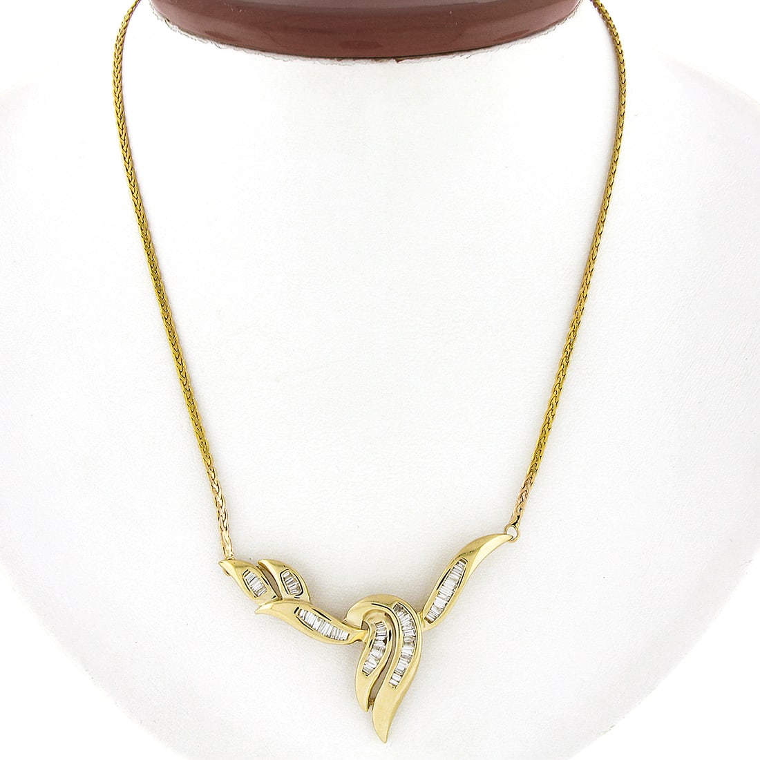 14k Yellow Gold 1.40ctw Baguette Diamond Chevron V Necklace: 14k Yellow Gold 1.40ctw Baguette Diamond Chevron V Necklace This exquisite necklace is crafted from solid 14k yellow gold and features a stunning chevron "V" shaped centerpiece adorned with channel-se