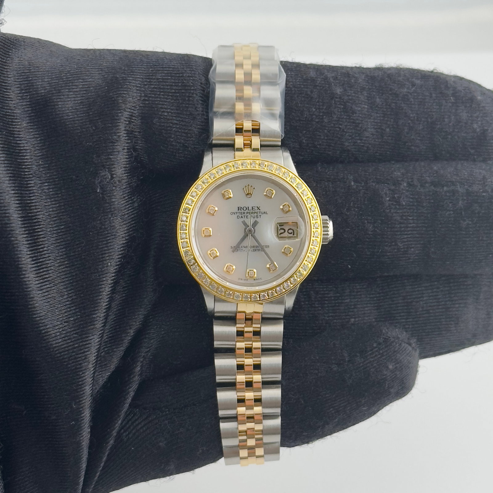 Rolex Datejust 6517 Ladies Watch With Aftermarket MOP Diamond Dial Jubilee Clasp: Rolex Datejust 6517 Ladies Watch With Aftermarket MOP Diamond Dial Jubilee Clasp This ladies' Rolex Datejust features an aftermarket white mother-of-pearl dial adorned with diamond markers, paired wit