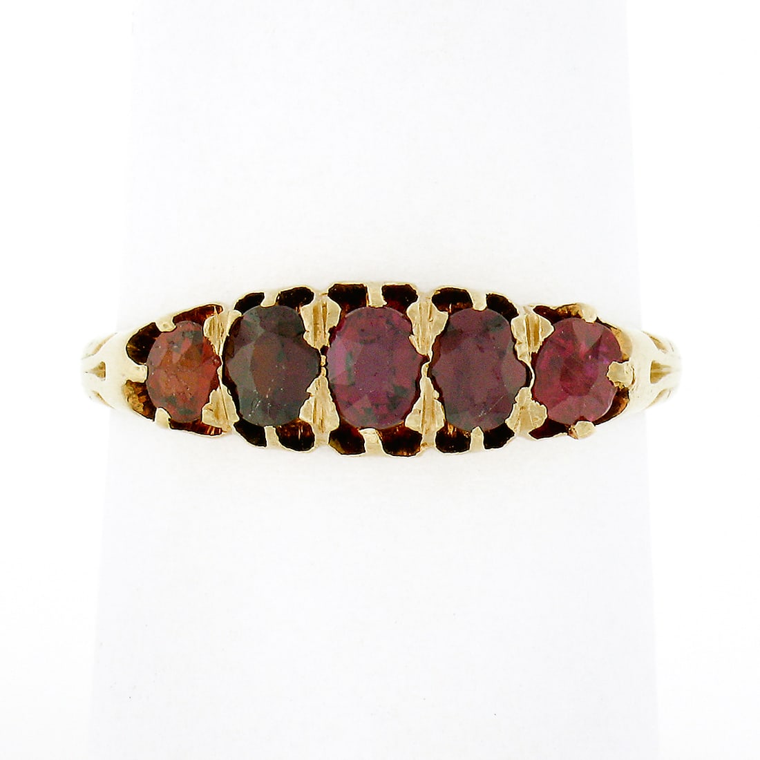 Antique Victorian 18K Gold 5 Stone Red Spinel Band Ring: Antique Victorian 18K Gold 5 Stone Red Spinel Band Ring This exquisite antique Victorian ring features a stunning band design crafted from solid 18K yellow gold. The ring showcases five graduating old