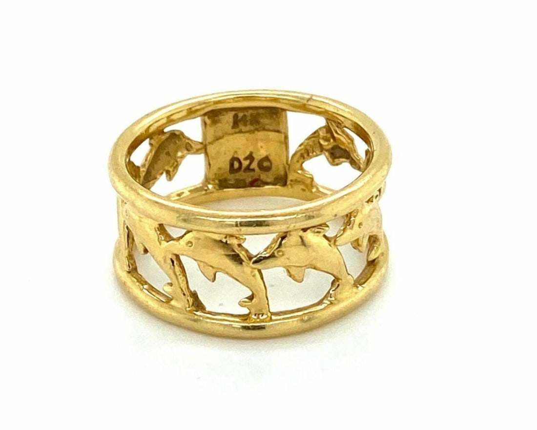 Unbranded 14k Yellow Gold Dolphin Band Ring Size 6.5: Unbranded 14k Yellow Gold Dolphin Band Ring Size 6.5 Vintage estate dolphin motif band ring crafted in solid 14k yellow gold. This wide polished band features sculptural dolphin motifs in a fluid, mar