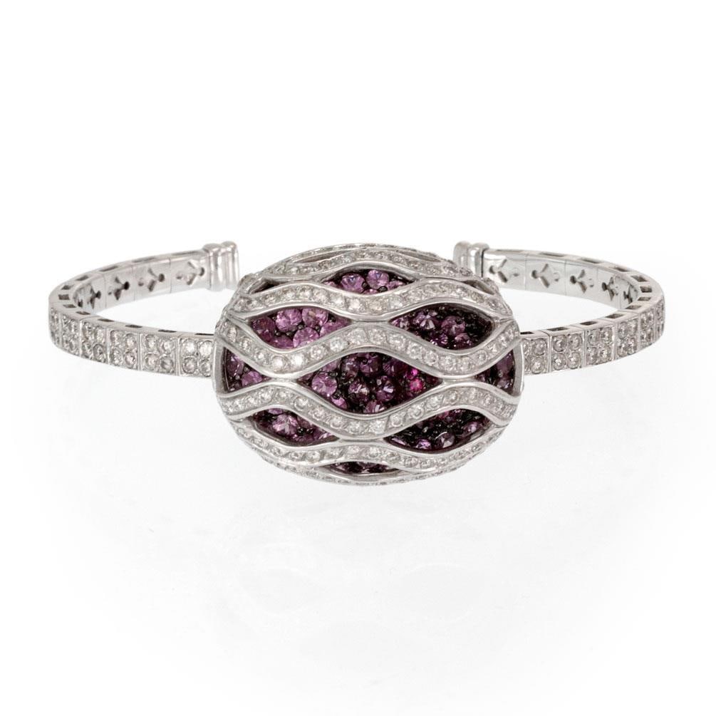 Elegant 18k White Gold Cuff Bracelet with Diamonds Pink Sapphires Rubellite: Elegant 18k White Gold Cuff Bracelet with Diamonds Pink Sapphires Rubellite This exquisite modern cuff bracelet is crafted from 18k white gold and features a striking open oval shape. The design showc
