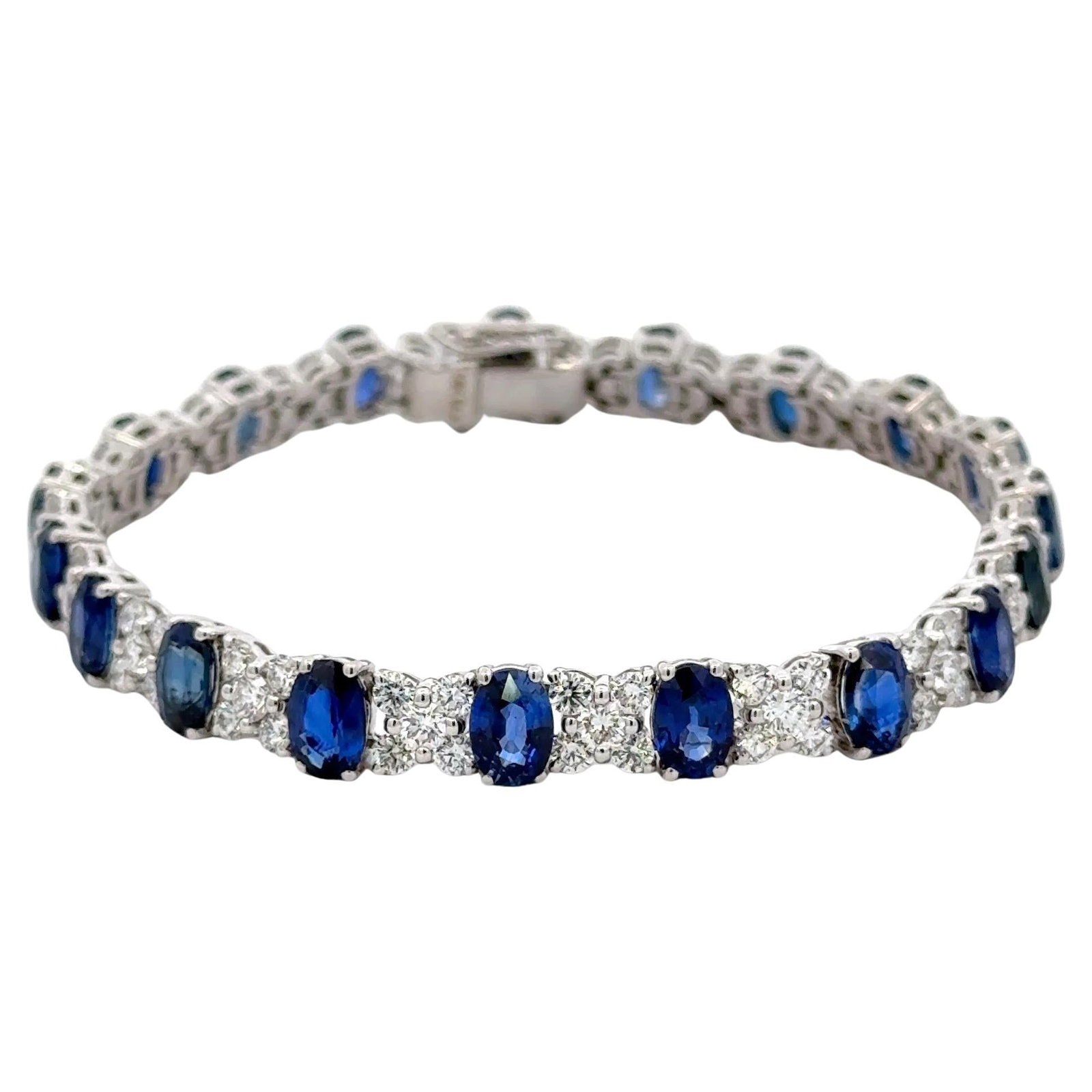Harbor Diamonds 18KT White Gold Sapphire Diamond Tennis Bracelet 22.80 CTTW: Harbor Diamonds 18KT White Gold Sapphire Diamond Tennis Bracelet 22.80 CTTW This exquisite 18KT white gold tennis bracelet showcases a stunning arrangement of alternating oval cut blue sapphires and r