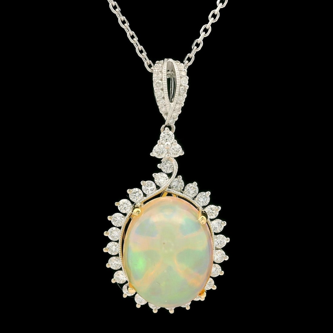 18K White Gold Opal Diamond Pendant Necklace 16 Inch Cable Link: 18K White Gold Opal Diamond Pendant Necklace 16 Inch Cable Link This exquisite pendant features a stunning natural opal with an oval cabochon cut, prong set in solid 18K white gold, showcasing a beaut