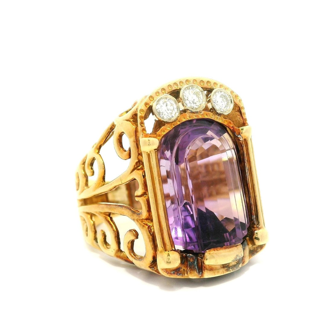 Vintage 18k Yellow Gold Custom Cut Amethyst Diamond Ring: Vintage 18k Yellow Gold Custom Cut Amethyst Diamond Ring This stunning vintage ring showcases a large, custom-cut natural amethyst set in solid 18k yellow gold. The amethyst features a unique rectangu