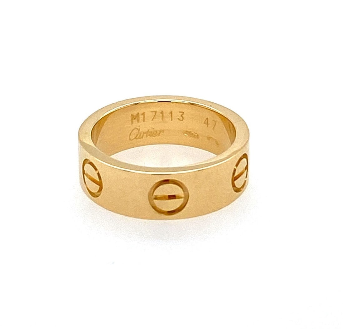 Cartier LOVE Band Ring 18k Yellow Gold Size 4 EU 47 with Certificate: Cartier LOVE Band Ring 18k Yellow Gold Size 4 EU 47 with Certificate Pre-owned Cartier LOVE band ring crafted in 18k yellow gold with the collection's signature screw motif. This signed ring is presen