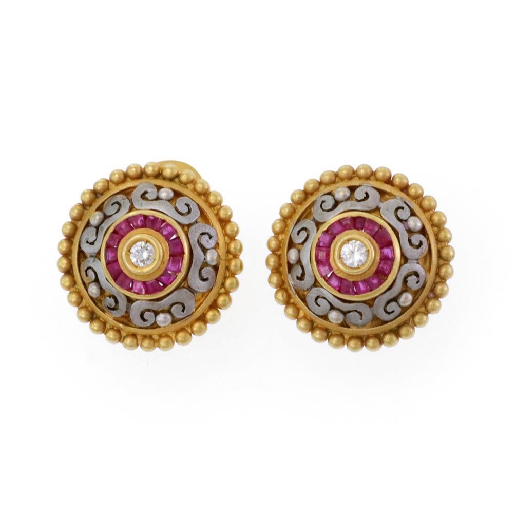 18k Gold Diamond and Ruby Etruscan Round Earrings: 18k Gold Diamond and Ruby Etruscan Round Earrings Elevate your elegance with this stunning pair of earrings, expertly crafted from 18k yellow and white gold. The dome-shaped design features a bezel-se