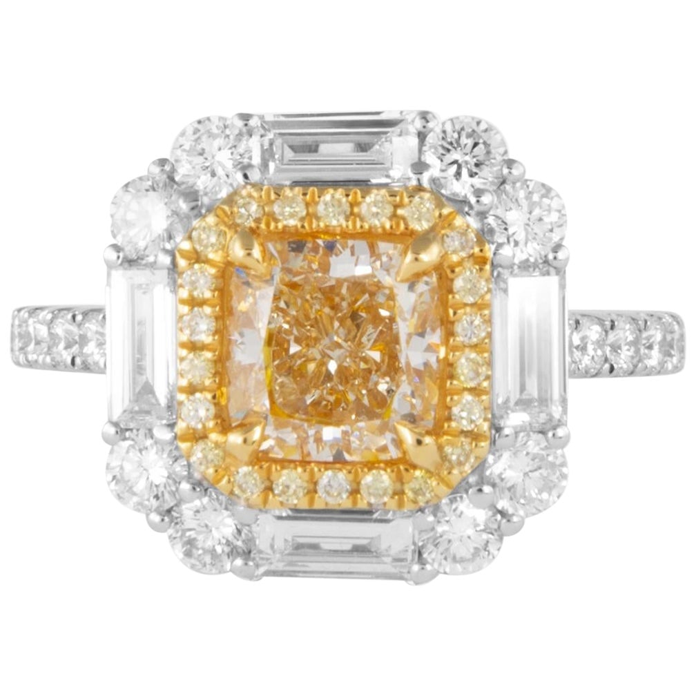 1.60ct EGL Certified Fancy Yellow Diamond Ring 18k Two Tone: 1.60ct EGL Certified Fancy Yellow Diamond Ring 18k Two Tone This exquisite 1.60ct Cushion Fancy Yellow Diamond Ring showcases a stunning natural fancy yellow diamond at its center, encircled by a doub