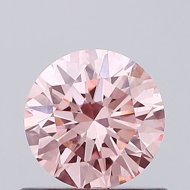 Loose Diamond - ROUND 0.66ct Fancy Vivid Pink VVS2: Loose Diamond - ROUND 0.66ct Fancy Vivid Pink VVS2 Source: This is a real non-mined Diamond that has been grown in a lab Shape: ROUND Carats: 0.66 Color: Fancy Vivid Pink Certification: IGI Video: