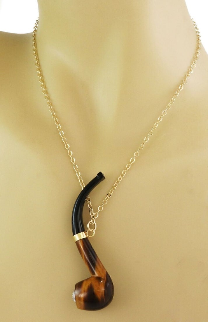 Vintage 14k Gold Pipe Pendant Necklace with Tiger's Eye Onyx Diamonds: Vintage 14k Gold Pipe Pendant Necklace with Tiger's Eye Onyx Diamonds Vintage estate pendant necklace in solid 14k yellow gold featuring a sculptural pipe-inspired design. The pendant is set with natu