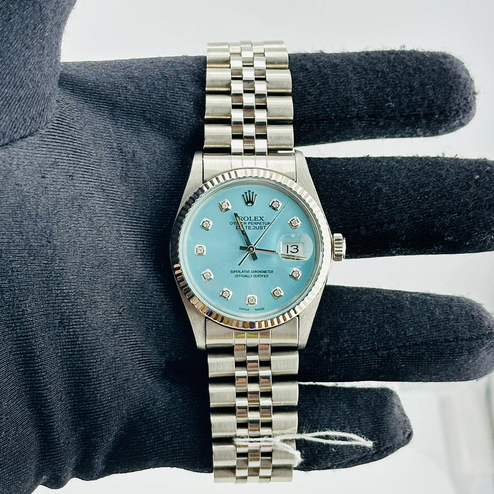 Rolex Datejust Ref. 16014 Mens Watch with aftermarket Jubilee bracelet: Rolex Datejust Ref. 16014 Mens Watch with aftermarket Jubilee bracelet This Rolex Datejust features a silver stick dial, fluted bezel, and is fitted with an aftermarket Jubilee bracelet. The watch is 