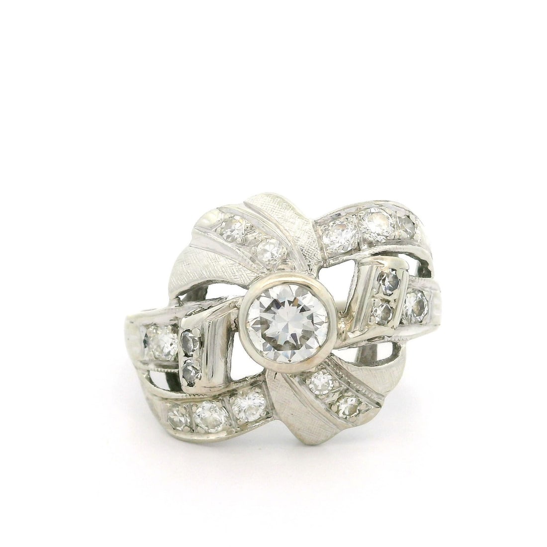 Vintage White Gold 0.85ctw Diamond Ribbon Cocktail Ring: Vintage White Gold 0.85ctw Diamond Ribbon Cocktail Ring This exquisite Vintage White Gold Cocktail Ring showcases a stunning bow style design, adorned with a total of 0.85 carats of natural diamonds. 