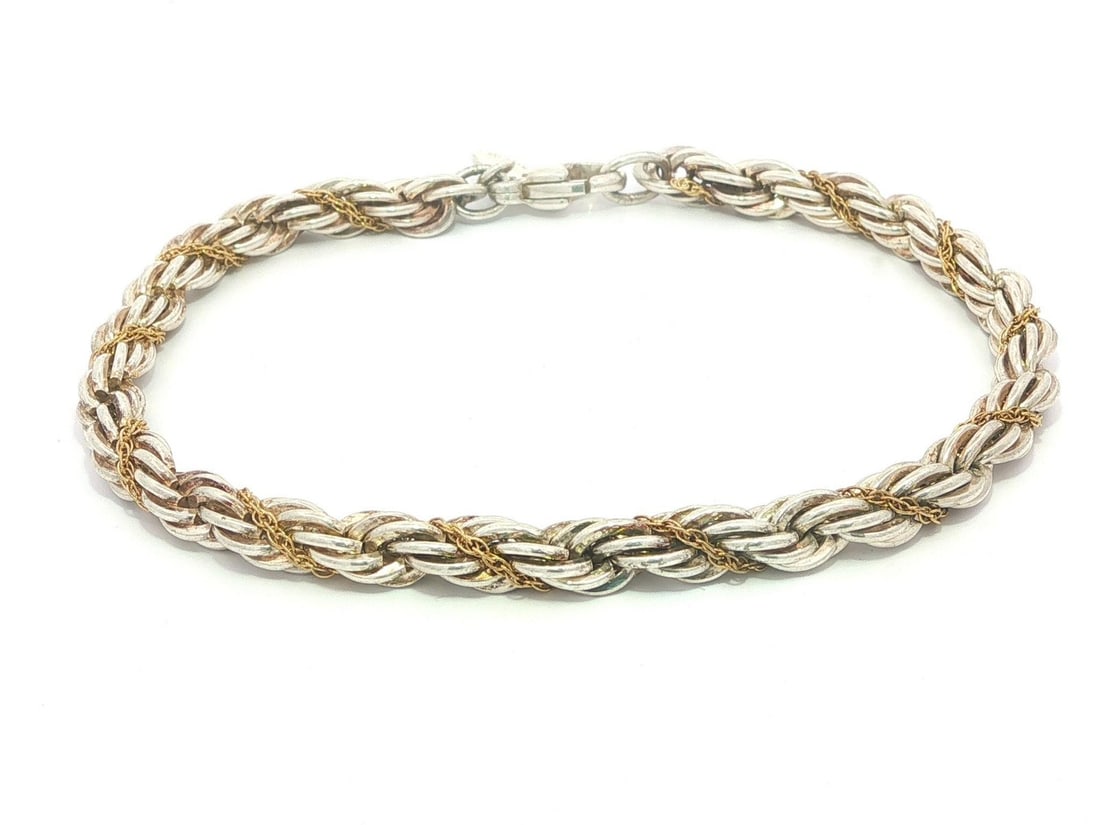 Tiffany & Co Braided Rope Link Bracelet Sterling Silver 18k Yellow Gold: Tiffany & Co Braided Rope Link Bracelet Sterling Silver 18k Yellow Gold Tiffany & Co. braided rope link chain bracelet crafted in solid sterling silver and 18k yellow gold. This women's bracelet featu