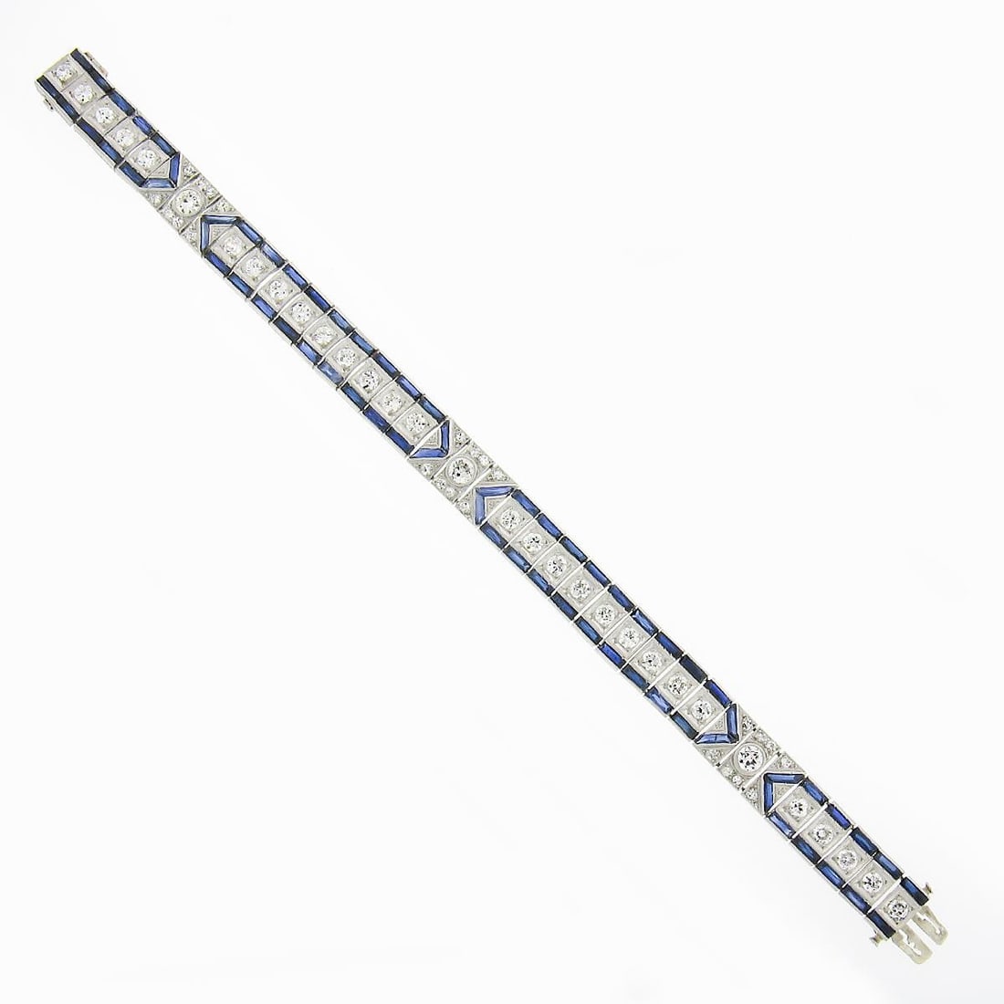 Art Deco platinum line bracelet with old European diamonds and sapphires: Art Deco platinum line bracelet with old European diamonds and sapphires Antique Art Deco line bracelet featuring old European cut diamonds and synthetic sapphires in rectangular articulated links. Cr