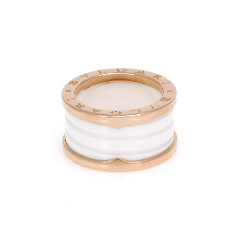 Bulgari B.zero1 18k Rose Gold Ceramic Ring Size 53: Bulgari B.zero1 18k Rose Gold Ceramic Ring Size 53 This exquisite B.zero1 ring from Bulgari showcases a unique blend of elegance and modern design. Crafted from 18k rose gold, the band features a poli