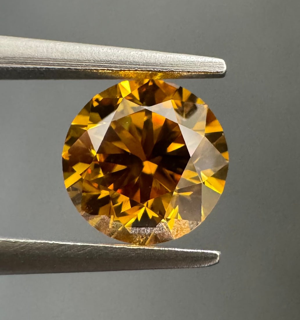 Loose Diamond - ROUND 0.63ct Fancy Deep Orange Yellow SI1: Loose Diamond - ROUND 0.63ct Fancy Deep Orange Yellow SI1 Source: Natural Shape: ROUND Carats: 0.63 Color: Fancy Deep Orange Yellow Certification: GIA PLEASE NOTE: Framed, Large, or heavy items do not