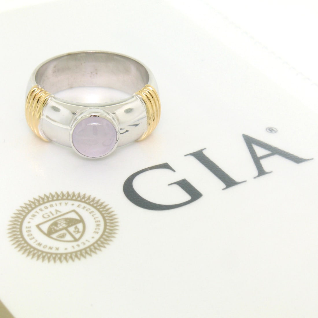Men's 18k Two Tone Gold GIA Certified Star Sapphire Ring: Men's 18k Two Tone Gold GIA Certified Star Sapphire Ring This stunning men's ring showcases a beautiful round natural star sapphire, certified by GIA, at its center. Crafted from solid 18k white and y