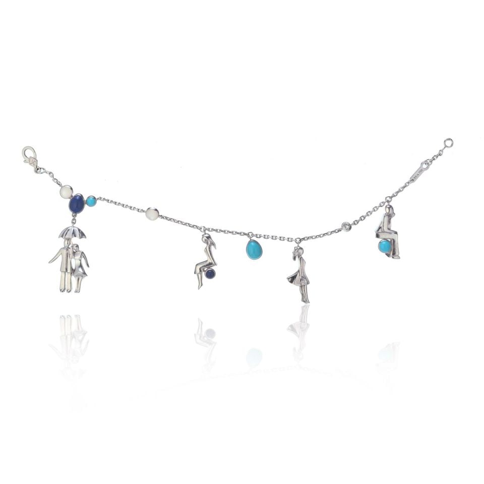 Van Cleef & Arpels 18K White Gold Romance In Paris Charm Bracelet: Van Cleef & Arpels 18K White Gold Romance In Paris Charm Bracelet This exquisite Van Cleef & Arpels Romance In Paris Charm Bracelet is a stunning piece crafted in 18K white gold, weighing 18.5 grams. 