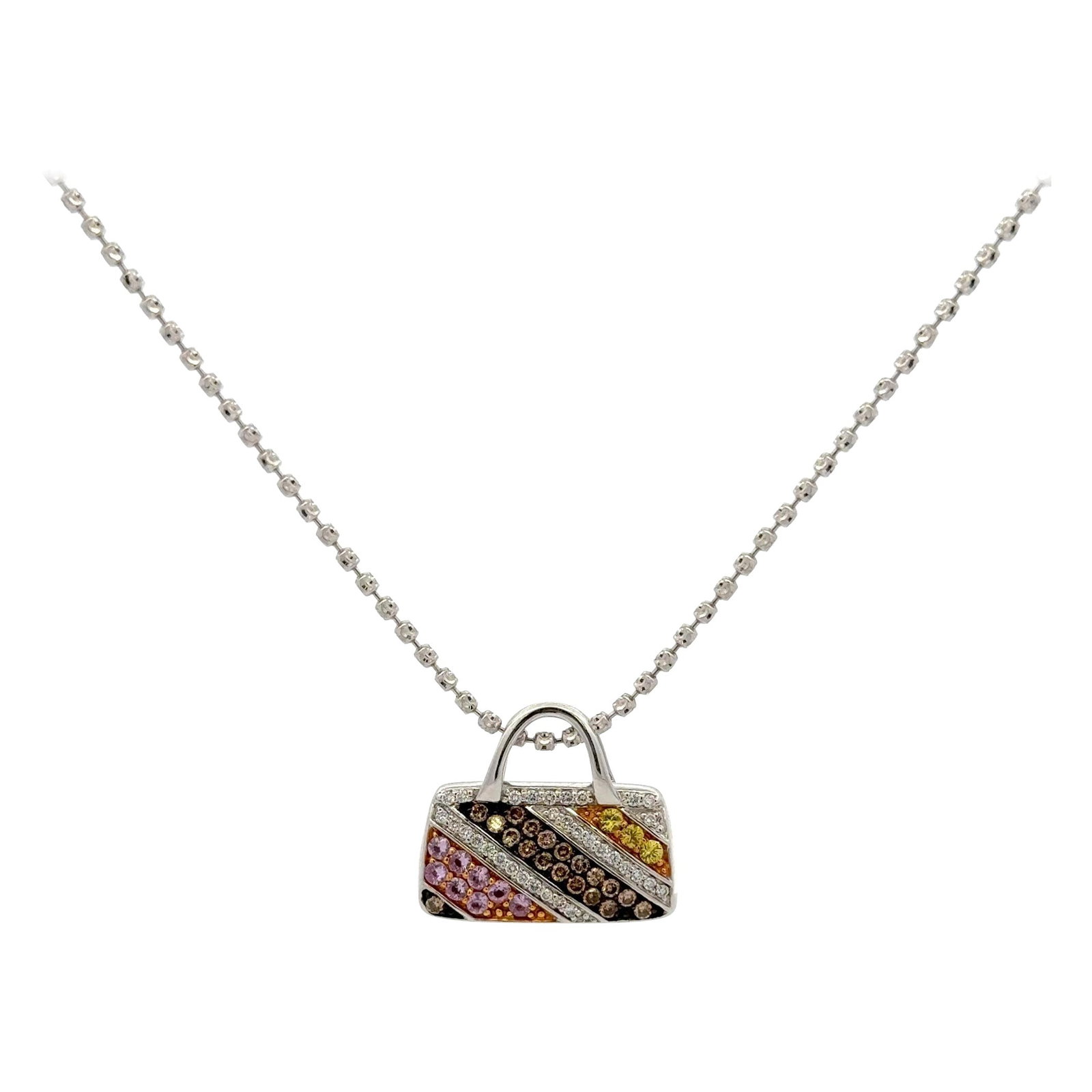 Harbor Diamonds 18K White Gold Purse Pendant with Diamonds and Multi-Colored Sapphires: Harbor Diamonds 18K White Gold Purse Pendant with Diamonds and Multi-Colored Sapphires This exquisite 18 Karat white gold pendant showcases a charming purse motif adorned with round brilliant