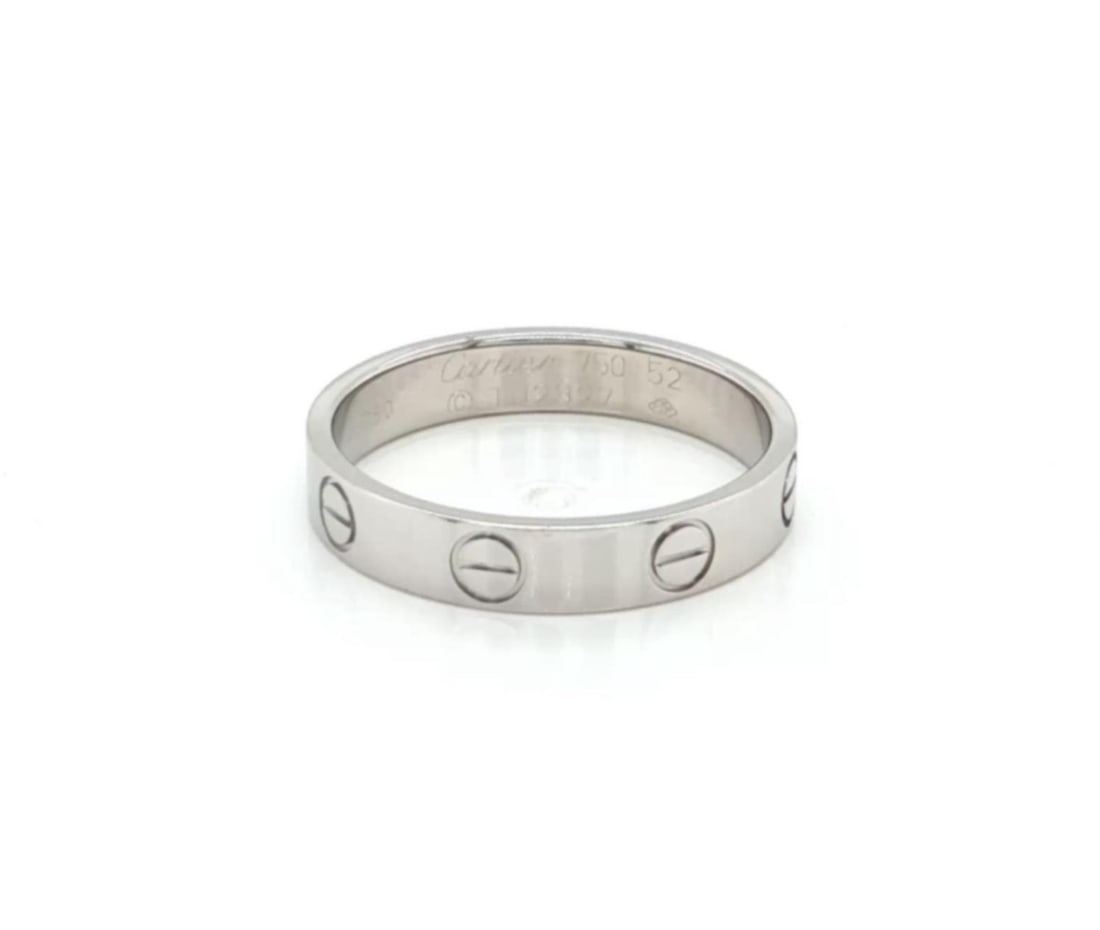 Cartier LOVE Mini Band Ring 18k White Gold Size 52: Cartier LOVE Mini Band Ring 18k White Gold Size 52 Authentic Cartier Mini LOVE band ring crafted in 18k white gold with the collection's signature screw motif. This slim band offers a classic polished