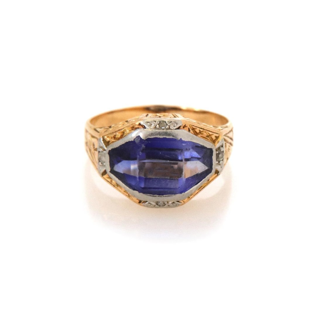 Art Deco 16k Two Tone Gold Ring with Diamonds and Blue Stone: Art Deco 16k Two Tone Gold Ring with Diamonds and Blue Stone This exquisite Art Deco ring features a stunning design crafted from 16k yellow gold and white gold accents. The centerpiece is a blue ston