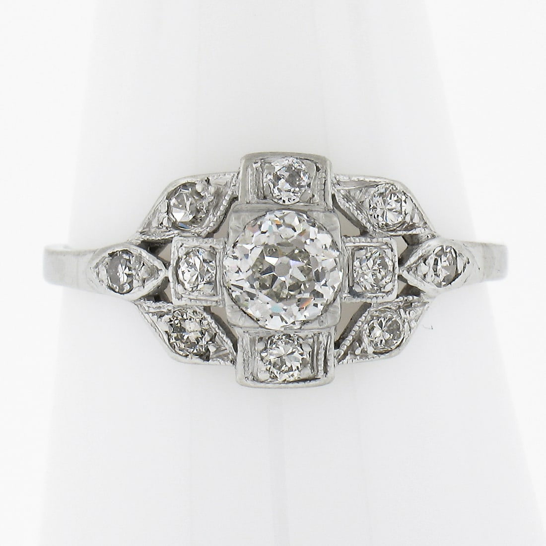 Art Deco platinum engagement ring with GIA 0.70ct old cut diamonds: Art Deco platinum engagement ring with GIA 0.70ct old cut diamonds Antique Art Deco engagement ring crafted in solid platinum with a natural old cut diamond center and diamond accents. The design feat