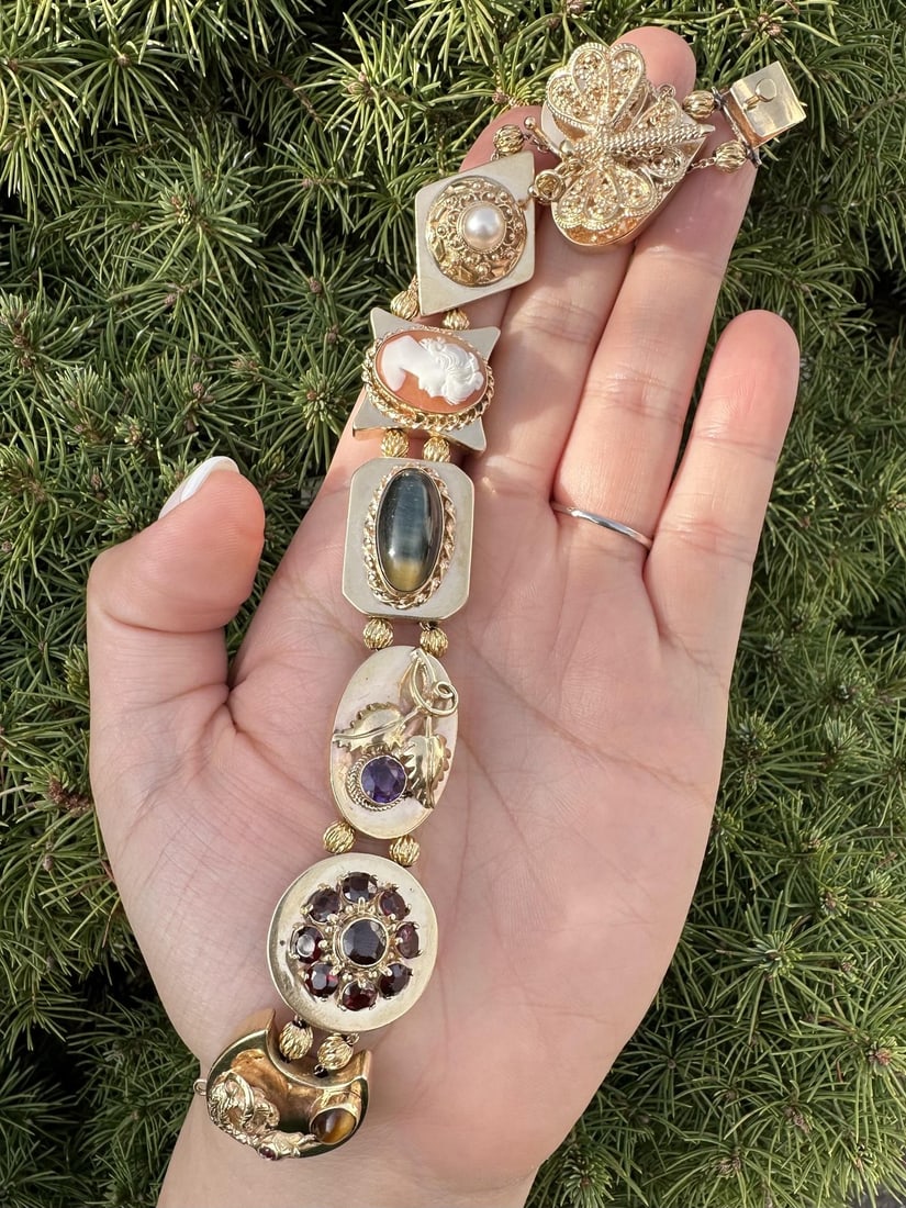 Vintage 13-14k Yellow Gold Multi Gemstone Slide Bracelet: Vintage 13-14k Yellow Gold Multi Gemstone Slide Bracelet This stunning vintage slide bracelet features a captivating design with multi gemstones, including natural pearls, amethyst, garnet, and tiger'