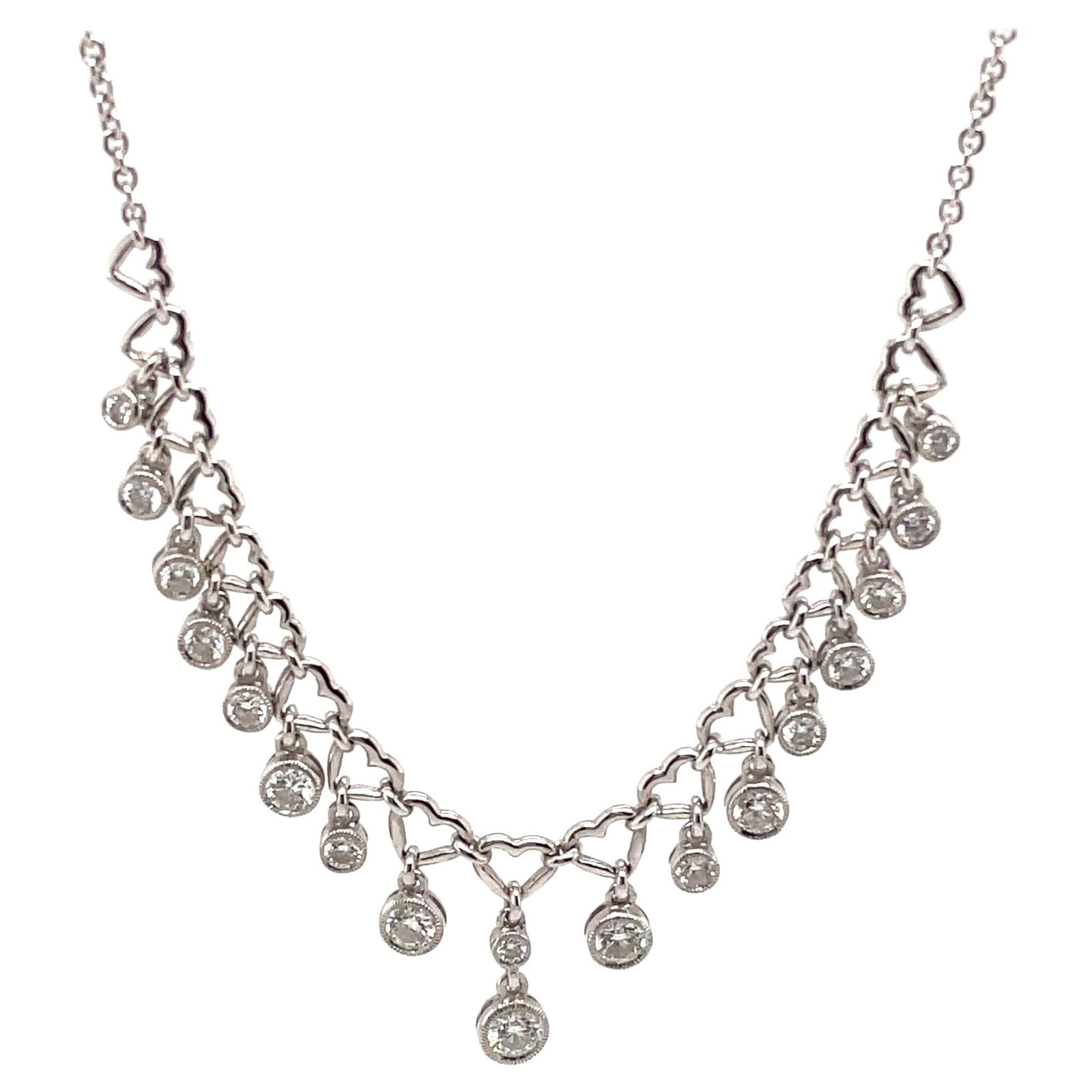 18k White Gold Heart Design Diamond Necklace 1.13ct G/H SI: 18k White Gold Heart Design Diamond Necklace 1.13ct G/H SI This exquisite necklace features a contemporary design with a charming heart motif, showcasing a total of 18 round brilliant diamonds that