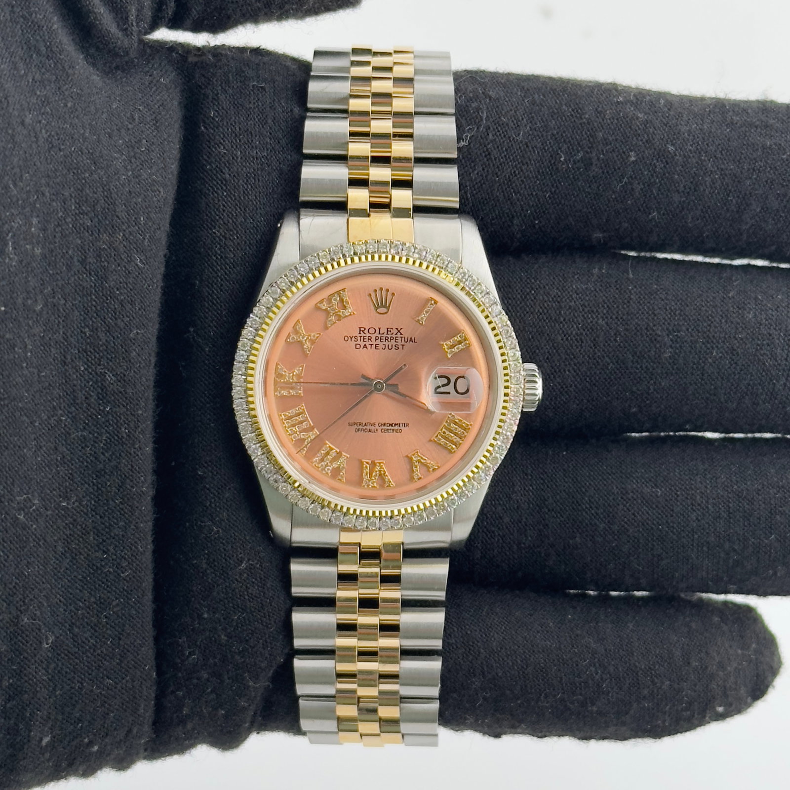 Rolex Datejust 1601 mens watch with aftermarket pink diamond Roman dial: Rolex Datejust 1601 mens watch with aftermarket pink diamond Roman dial Rolex Datejust reference 1601 with an Aftermarket pink Roman diamond dial, prong YG plated diamond bezel, and Aftermarket Jubile