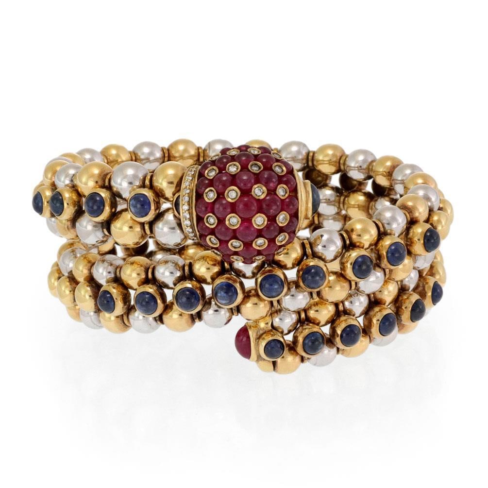 Vintage 18k Gold 3 Row Beaded Wrap Bracelet with Ruby Sapphire and Diamonds: Vintage 18k Gold 3 Row Beaded Wrap Bracelet with Ruby Sapphire and Diamonds This stunning vintage bracelet features a luxurious design crafted from high polished 18k yellow and white gold. It showcase