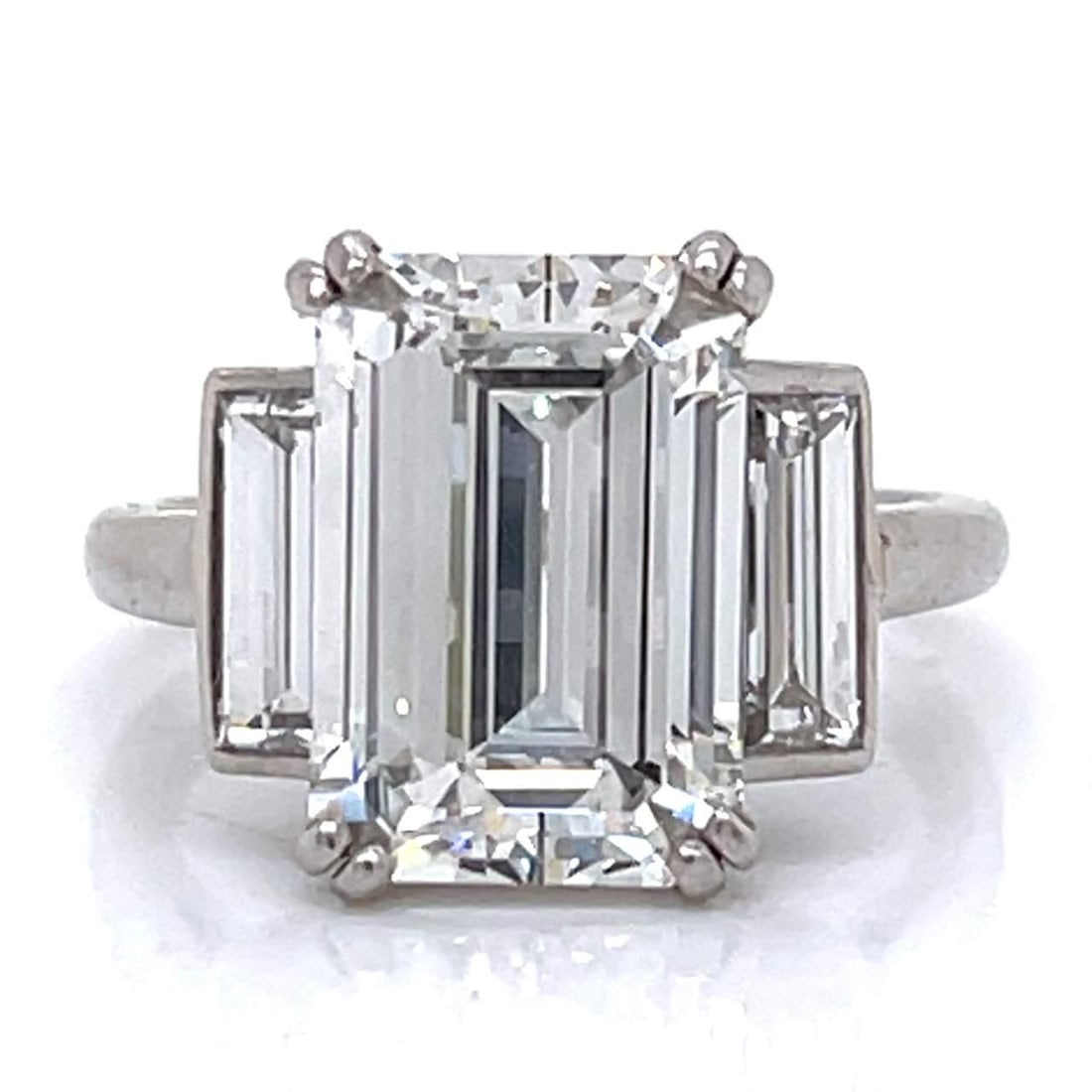 French Art Deco Platinum Ring GIA Certified 4.13 Ct Diamond E VS2: French Art Deco Platinum Ring GIA Certified 4.13 Ct Diamond E VS2 Discover this exquisite French Art Deco ring, crafted from platinum and featuring a GIA Certified 4.13 ct emerald-cut diamond. This st