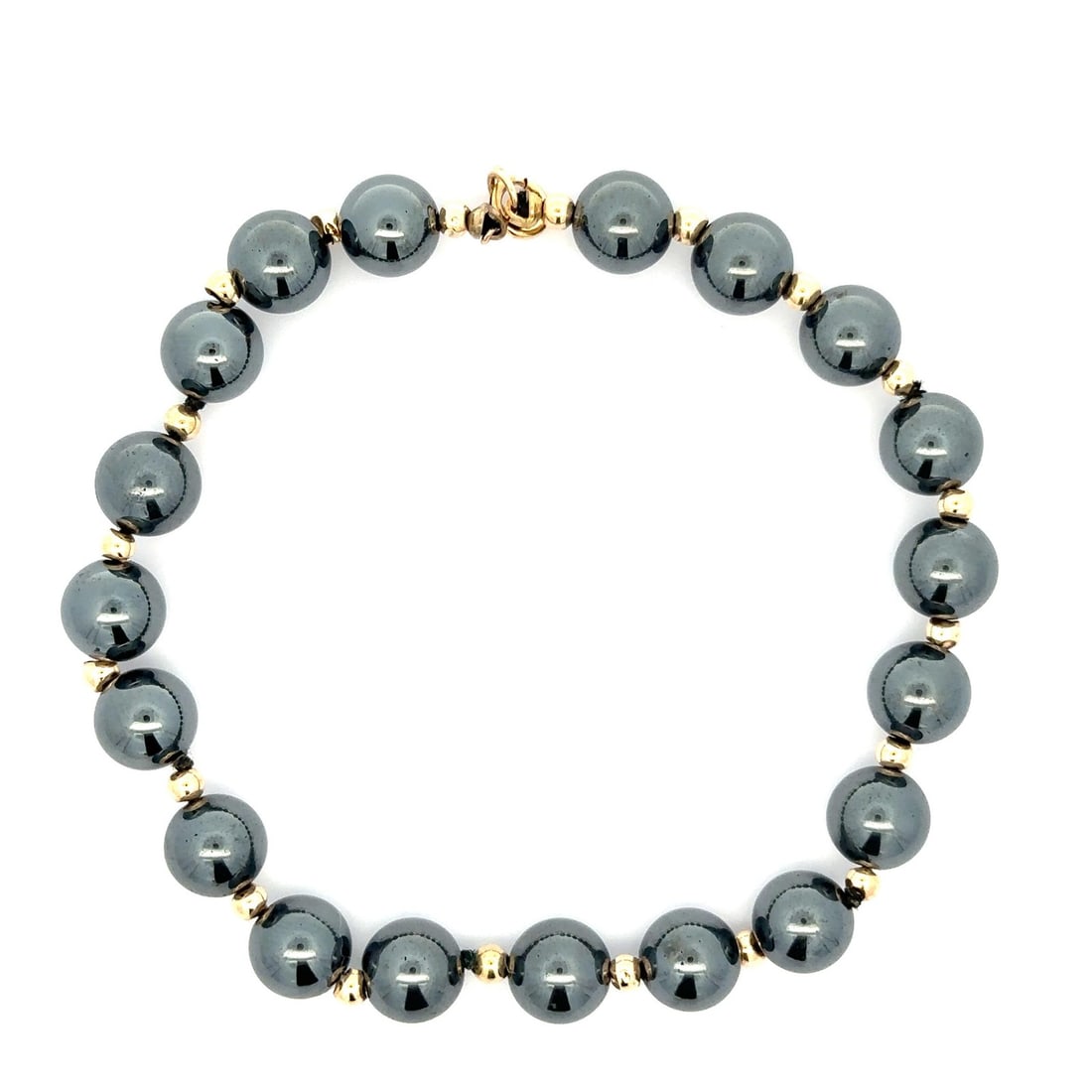 Vintage 14k Yellow Gold Hematite Bead Bracelet Spring Ring Clasp: Vintage 14k Yellow Gold Hematite Bead Bracelet Spring Ring Clasp This vintage bracelet features a stunning combination of 14k yellow gold and natural hematite beads, showcasing a beautiful beaded desi