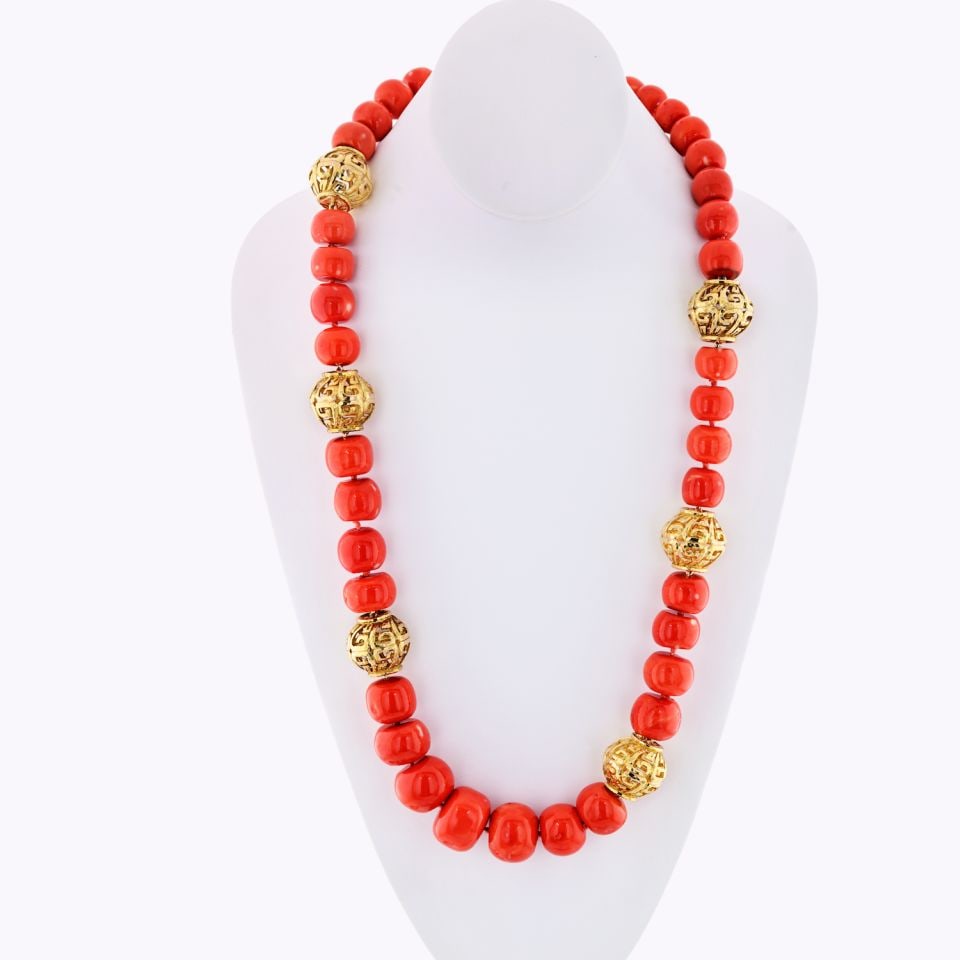 David Webb Coral Bead Necklace 18K Yellow Gold 29 Inch: David Webb Coral Bead Necklace 18K Yellow Gold 29 Inch This stunning necklace showcases the artistry of David Webb, featuring a striking array of coral beads interspersed with hammered 18K yellow gold