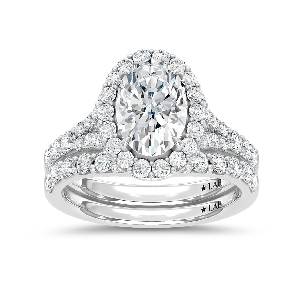 14K White Gold 3 Ct.Tw. Lab Grown Diamond Oval Shape Bridal Ring (IGI Certified Center 2ct Oval): 14K White Gold 3 Ct.Tw. Lab Grown Diamond Oval Shape Bridal Ring (IGI Certified Center 2ct Oval) 14k White Gold Stone Color: D-f Stone Clarity: Vs Each ring is presented in standard size 6.5. Complime