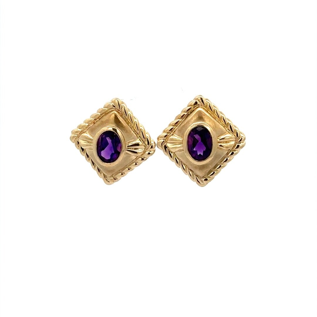 14K Yellow Gold 0.90ct Oval Amethyst Bezel Stud Earrings: 14K Yellow Gold 0.90ct Oval Amethyst Bezel Stud Earrings Elevate your elegance with these stunning 14K Yellow Gold Oval Bezel Amethyst Cable Frame Button Stud Earrings. Designed for versatility, these