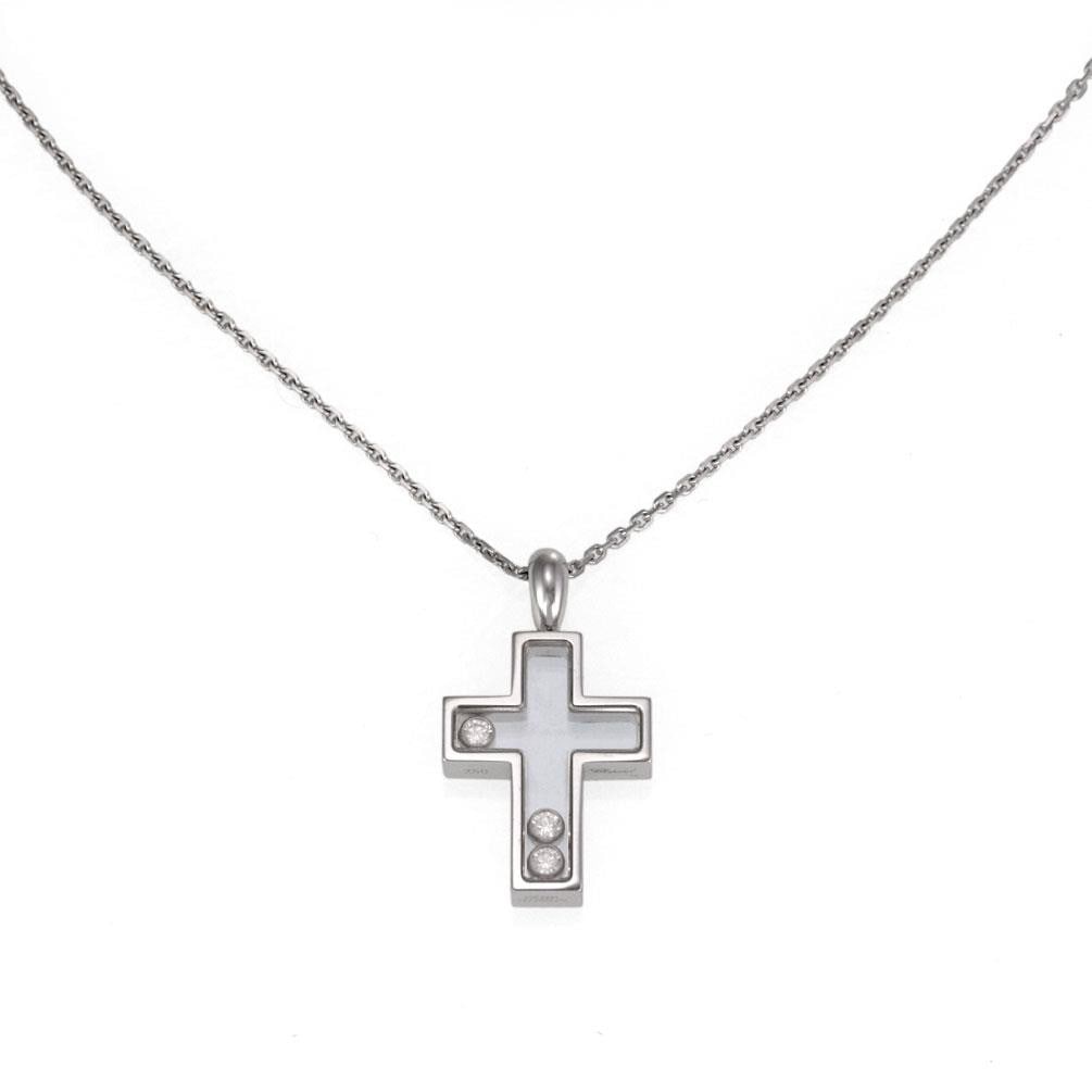 Happy Diamonds Cross Pendant Necklace in 18k White Gold with Floating Diamonds: Happy Diamonds Cross Pendant Necklace in 18k White Gold with Floating Diamonds This authentic Chopard necklace from the Happy Diamonds collection is crafted from 18k white gold. It features a cross pe