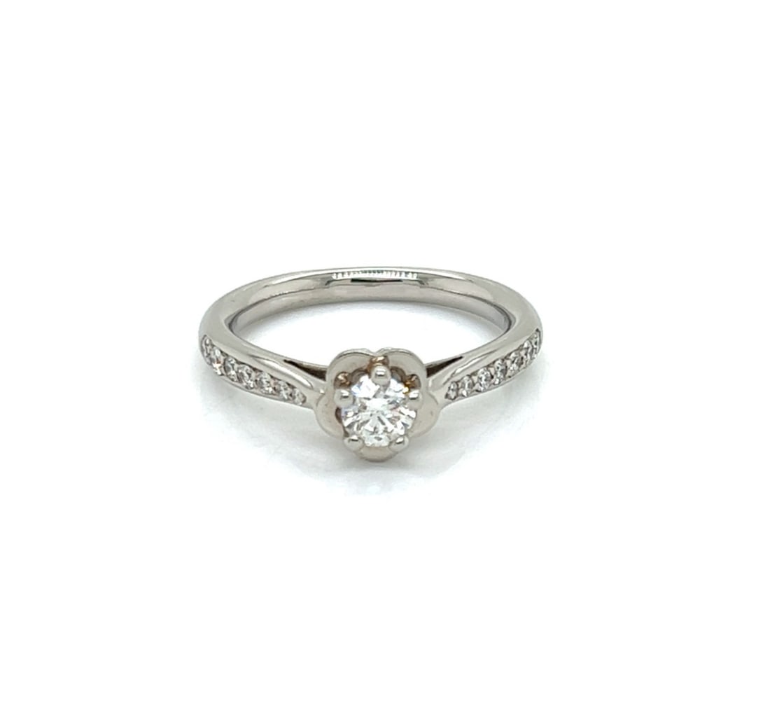 Chanel Camellia Platinum Engagement Ring 0.25ct E VVS2 GIA Size 5.5: Chanel Camellia Platinum Engagement Ring 0.25ct E VVS2 GIA Size 5.5 Pre-owned Chanel Camellia engagement ring crafted in platinum with a camellia flower motif and elegant double split shank. The ring 