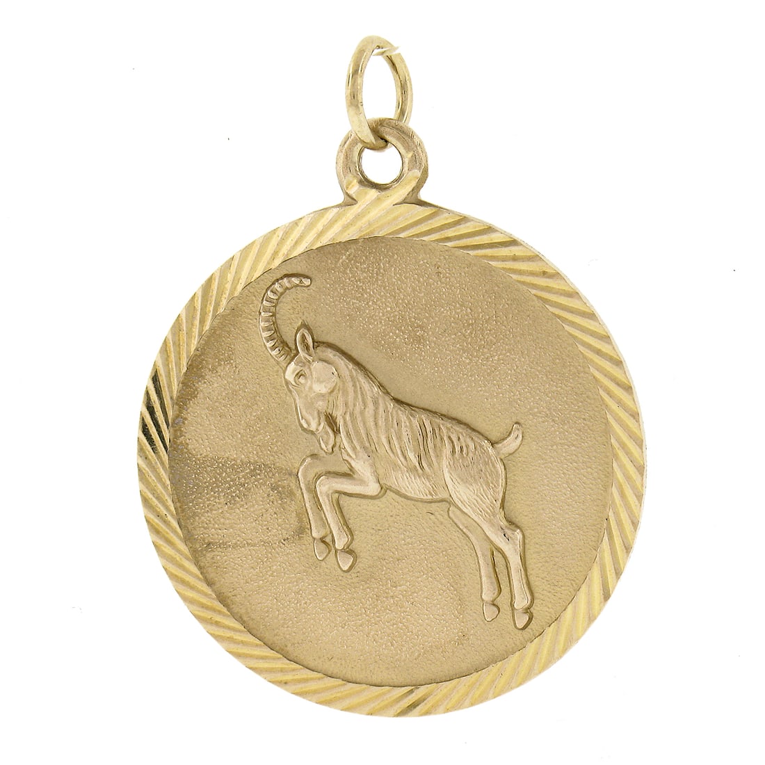 Vintage 9ct Gold Capricorn Zodiac Textured Charm Pendant: Vintage 9ct Gold Capricorn Zodiac Textured Charm Pendant This exquisite vintage charm pendant features a round medallion design crafted from 9ct solid yellow gold. The Capricorn Zodiac symbol is beaut