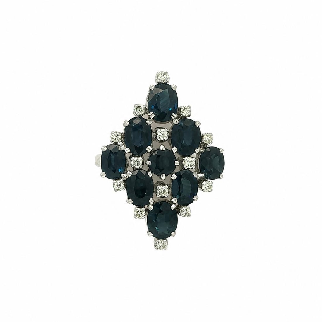 Sterling Silver Navette Cocktail Ring with Oval Sapphire and Diamond Accents: Sterling Silver Navette Cocktail Ring with Oval Sapphire and Diamond Accents Vintage navette-style cocktail ring featuring natural blue sapphires accented by natural diamonds in sterling silver. The e