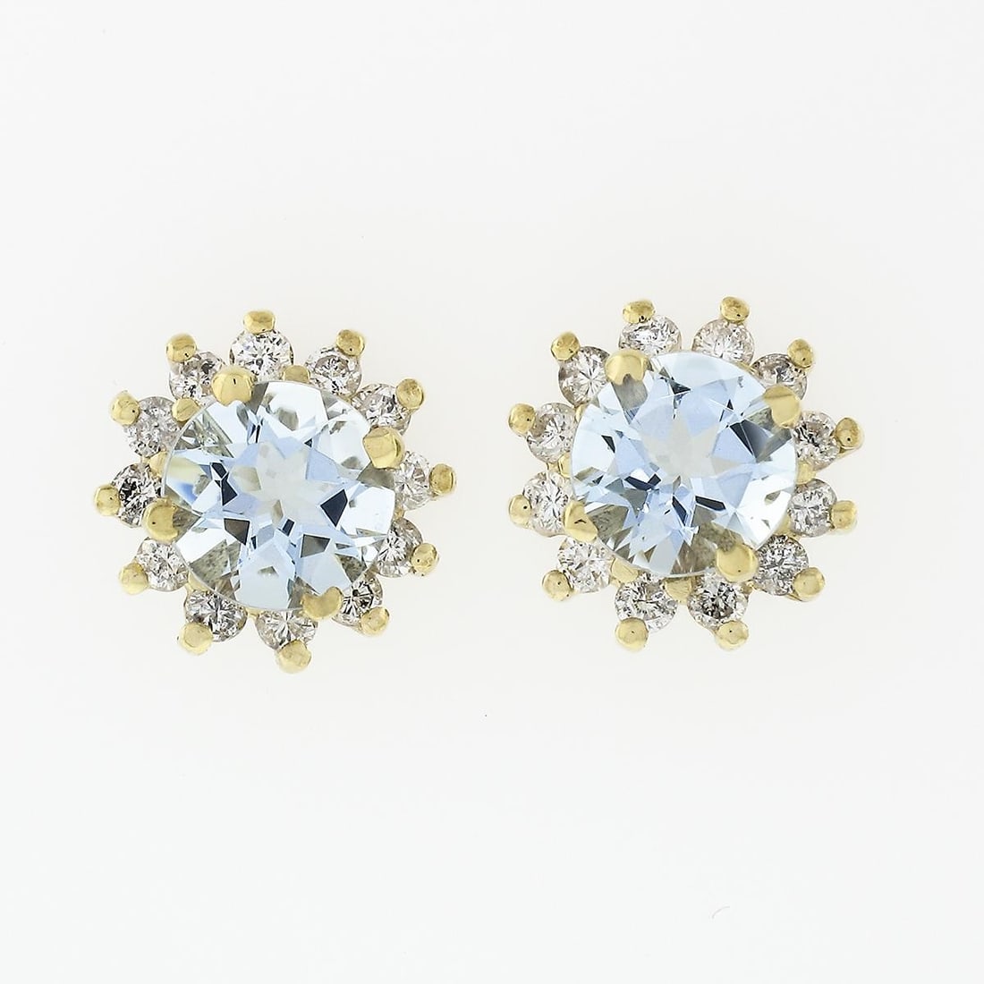 14k Yellow Gold Stud Earrings with Aquamarine Diamond Halo Cluster: 14k Yellow Gold Stud Earrings with Aquamarine Diamond Halo Cluster Un-used pair of stud earrings featuring natural round brilliant-cut aquamarines surrounded by a halo cluster of natural diamonds. Cra