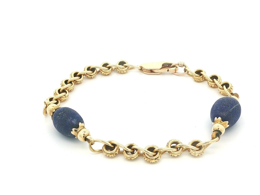 Lapis Station Bracelet in 17-18K Yellow Gold Textured Link Chain: Lapis Station Bracelet in 17-18K Yellow Gold Textured Link Chain This vintage stackable bracelet features a textured link design crafted from solid 17-18K yellow gold, complemented by a 14K gold end r