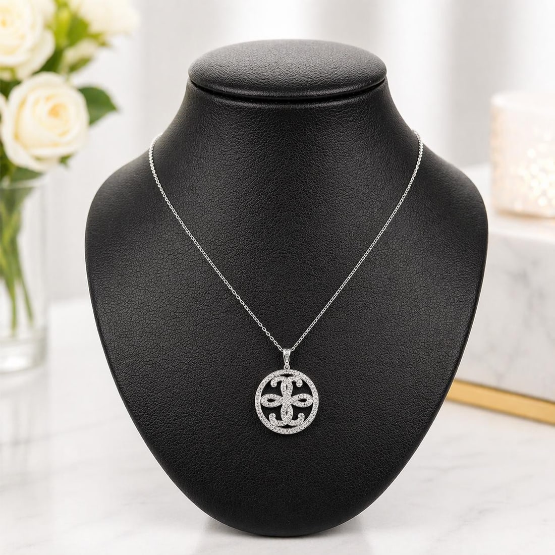 14k White Gold Diamond Floral Disc Pendant Necklace 20 in: 14k White Gold Diamond Floral Disc Pendant Necklace 20 in This elegant pendant necklace features a round disc design with a floral motif, crafted from 14k solid white gold. The pendant is adorned with