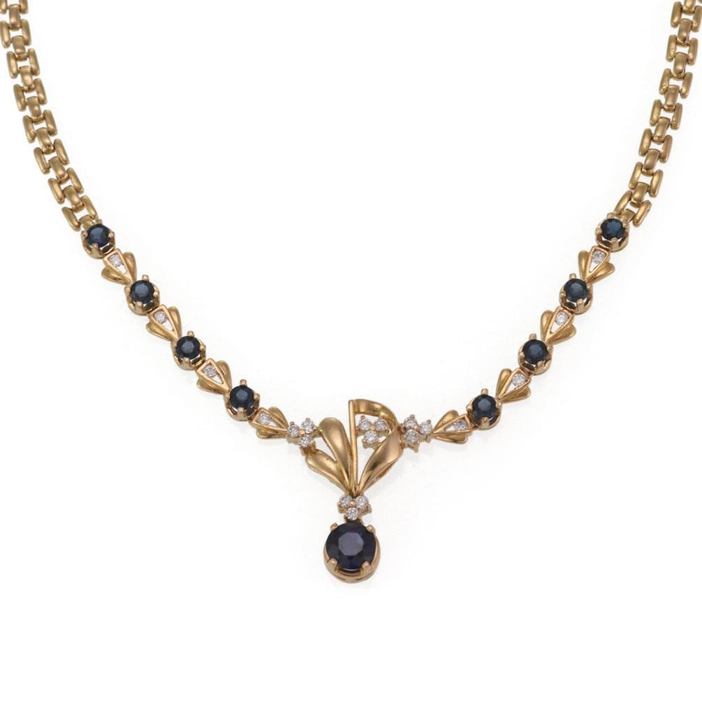 Elegant 4.70ct Sapphire Diamond 18k Yellow Gold Floral Necklace: Elegant 4.70ct Sapphire Diamond 18k Yellow Gold Floral Necklace This exquisite floral necklace is crafted from 18k yellow gold, featuring a stunning design that highlights a larger round cut sapphire 