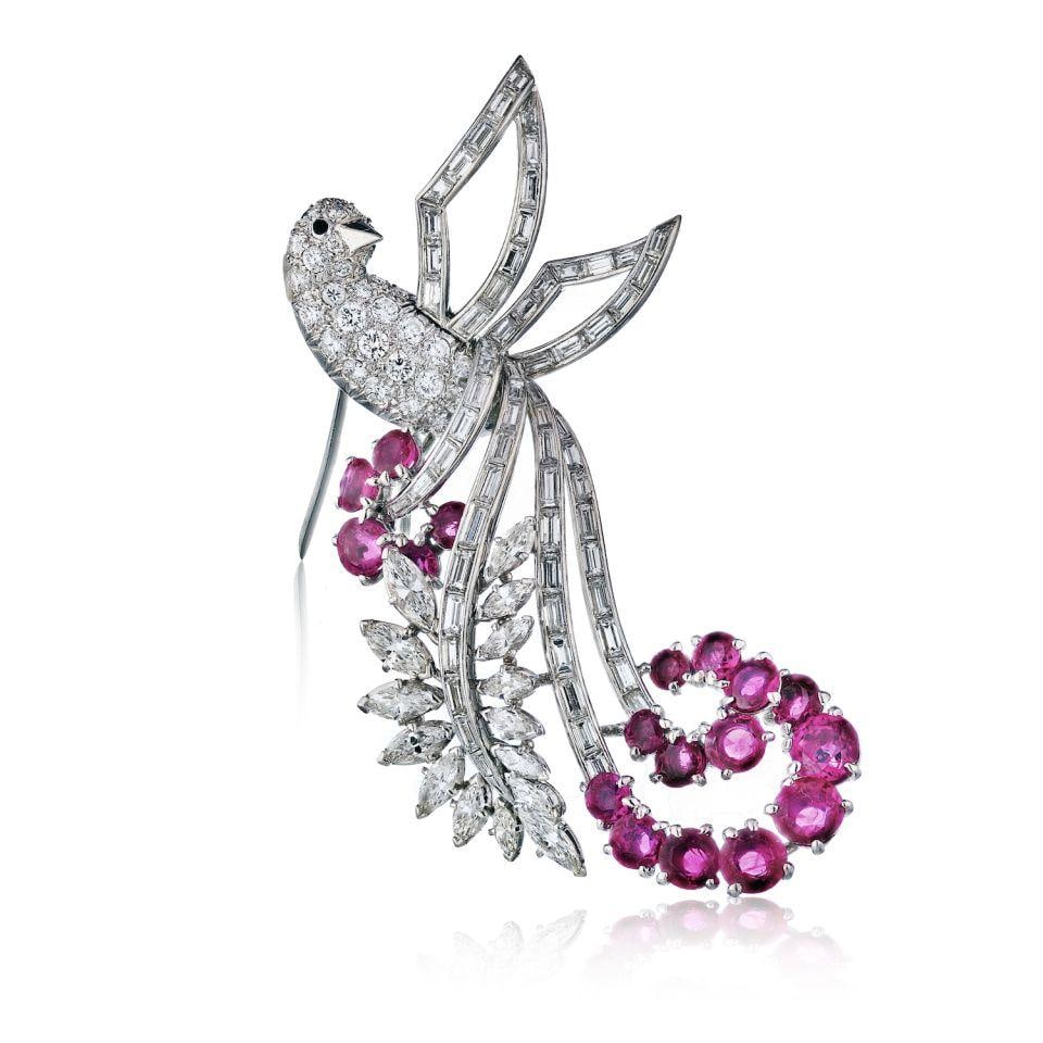 Platinum bird brooch with ruby and diamond accents circa 1950s: Platinum bird brooch with ruby and diamond accents circa 1950s Pre-owned circa 1950's bird brooch crafted in platinum and accented with ruby and diamond details. Specifications Item Type: Brooch Style