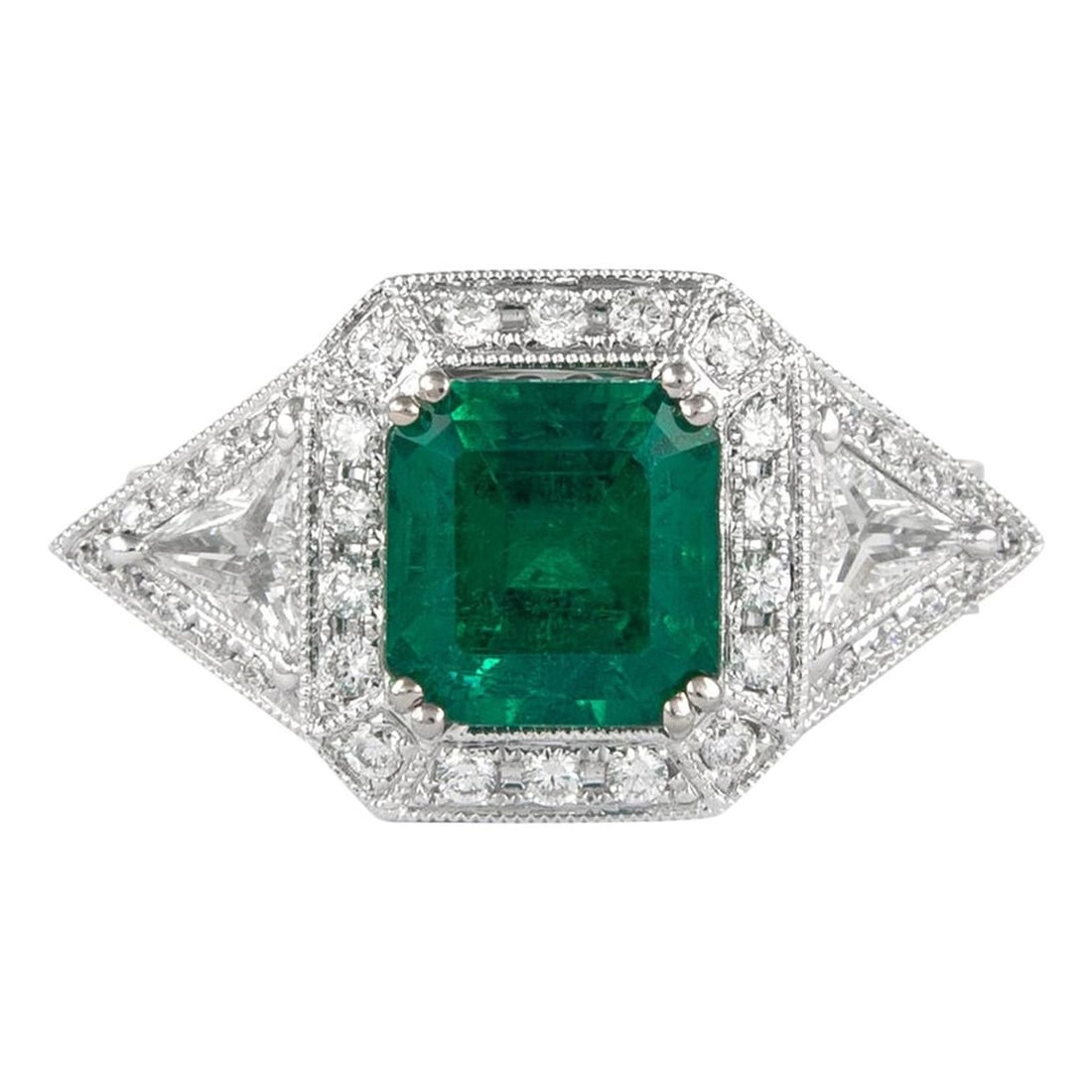 2.50ct Emerald Cut Diamond Ring in 18k White Gold: 2.50ct Emerald Cut Diamond Ring in 18k White Gold This stunning 2.50ct emerald and diamond ring features a striking emerald cut emerald at its center, flanked by a halo of round brilliant and trillian