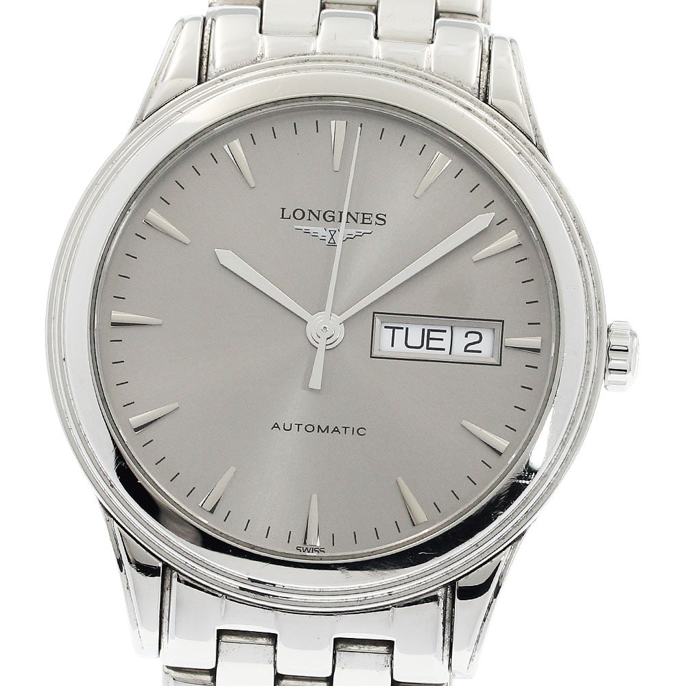 Longines Flagship automatic day-date men's stainless steel watch: Longines Flagship automatic day-date men's stainless steel watch This Longines Flagship Day-Date men's wristwatch features a stainless steel case and bracelet with a silver dial. The watch is powered 
