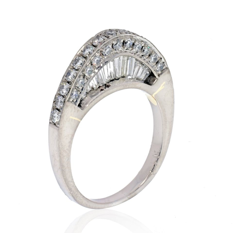 Platinum 2.3 Cts Arched Pave Baguette Wedding Ring: Platinum 2.3 Cts Arched Pave Baguette Wedding Ring This exquisite estate wedding ring features a stunning design crafted in platinum. The ring showcases an arched pave setting adorned with baguette di