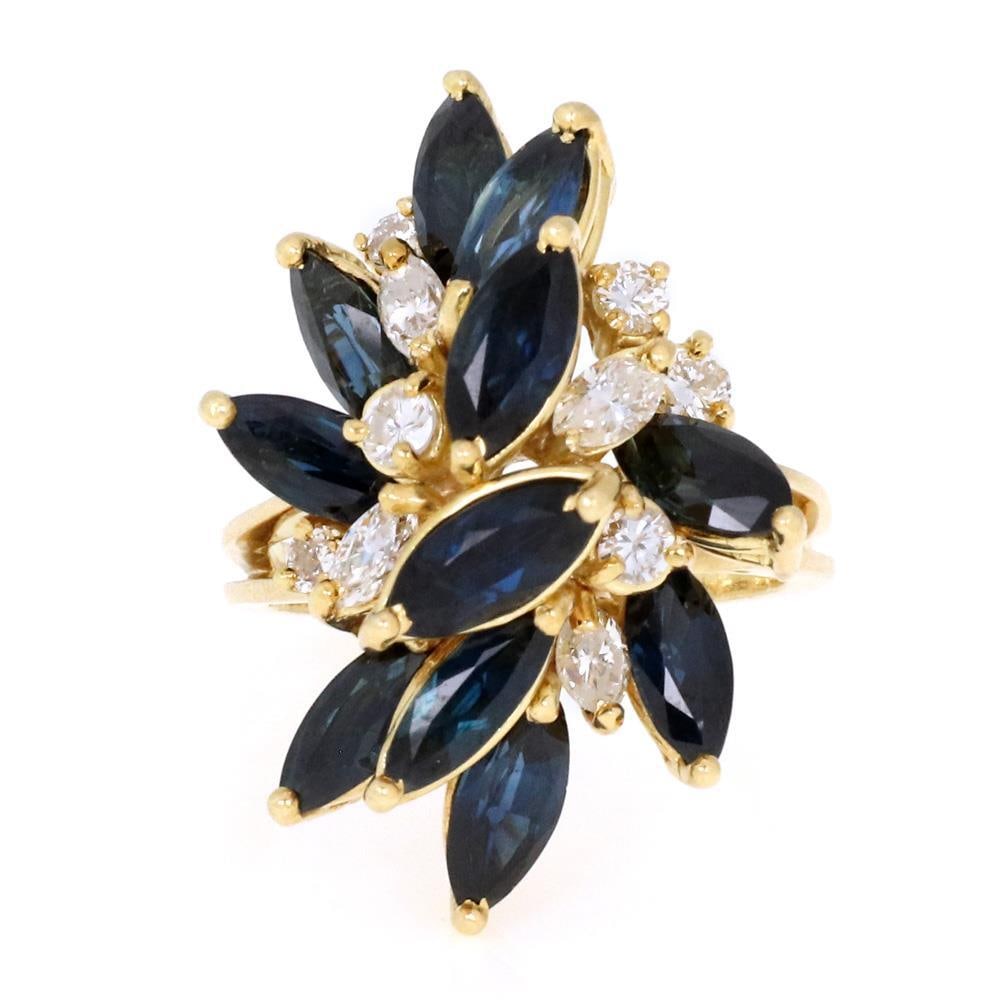 Estate 7.00ct Sapphire & Diamond Cluster Ring in 18k Yellow Gold: Estate 7.00ct Sapphire & Diamond Cluster Ring in 18k Yellow Gold This exquisite estate ring features a stunning cluster design crafted from 18k yellow gold. It showcases a total of 1.00 carat of round